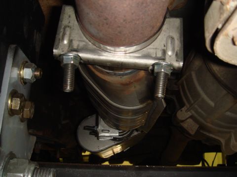 1996 Ford Bronco - This photo shows a close-up view of a vehicle's exhaust system, focusing on a clamp securing the pipe.