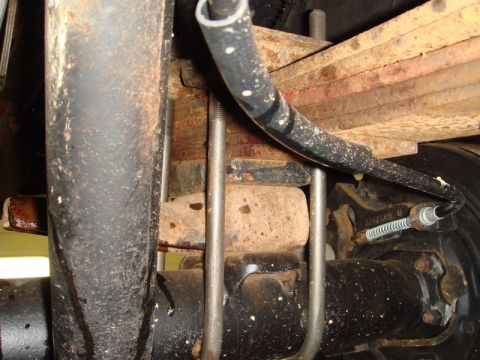 1996 Ford Bronco - Close-up view of the rear suspension components, including leaf springs and U-bolts.