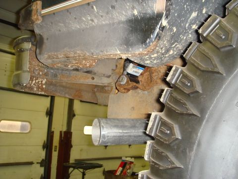1996 Ford Bronco - Exhaust pipe and tire detail, with visible frame rust.