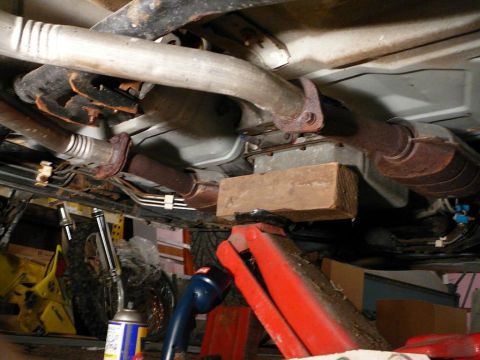 1997 Mercury Grand Marquis - Transmission crossmember was unbolted from the frame and from the transmission and then slid back out of the way.