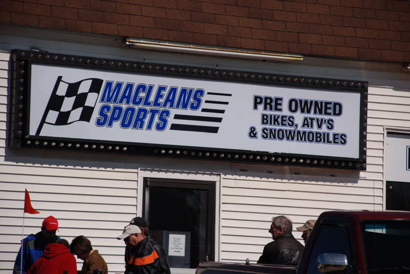 Sign for Macleans Sports selling pre-owned bikes, ATVs, and snowmobiles