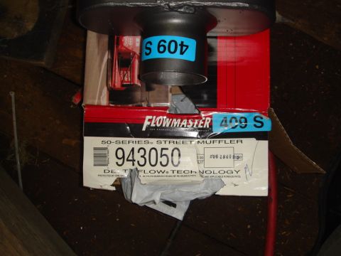 1996 Ford Bronco - A Flowmaster 409S street muffler is shown in its packaging, with part number 943050 visible.