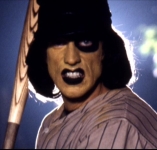 1973 Ford Ranchero - A person dressed as a menacing baseball player with face paint and a bat.