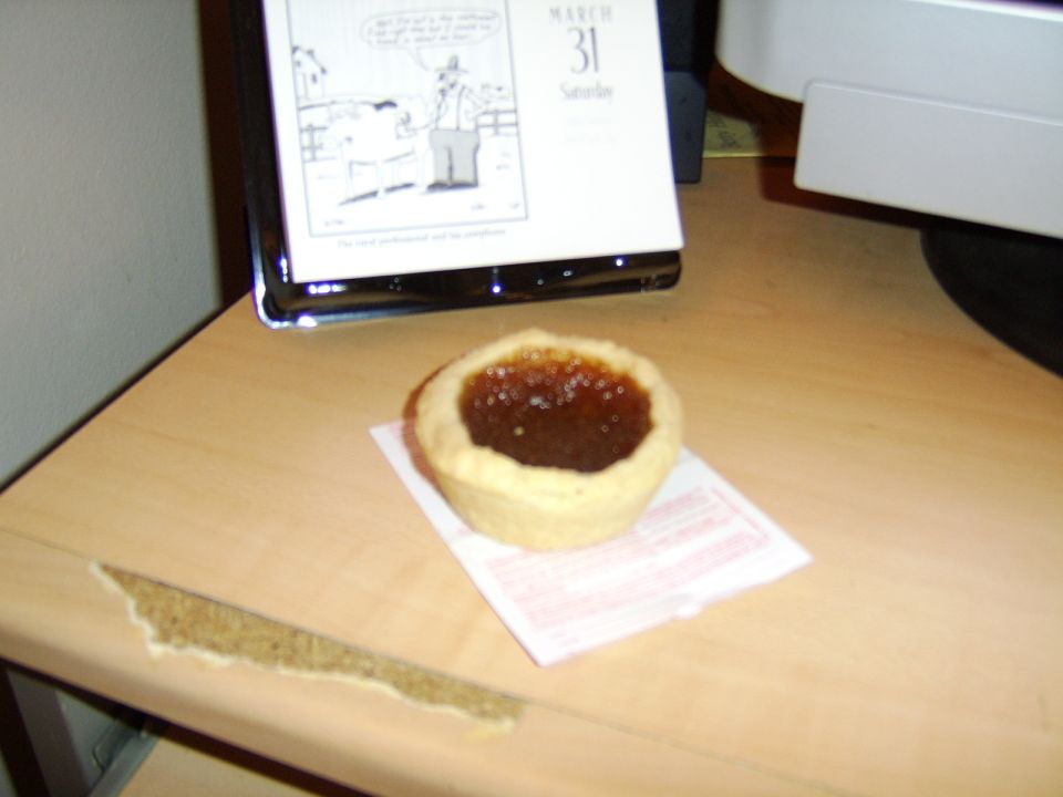 pastry sits on a napkin next to a desk calendar showing March 31