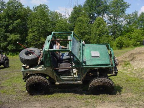 1992 Ford Bronco - A custom off-road buggy sits in a grassy area with trees in the background. Another vehicle is visible to the left.