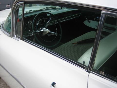 1996 Ford Bronco - Interior view of a classic car, likely from the late 1950s, a two-tone dashboard and bench seat.