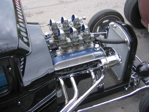 1996 Ford Bronco - Hot rod V8 engine with dual carburetors and chrome headers. The valve cover reads "INTERCEPTOR".