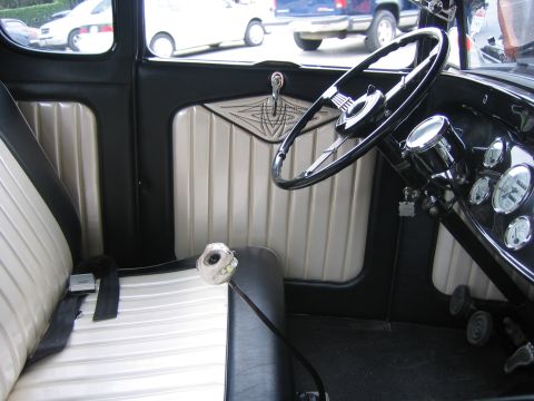 1996 Ford Bronco - The interior of a classic car shows off its unique gear shift knob and ribbed seating.