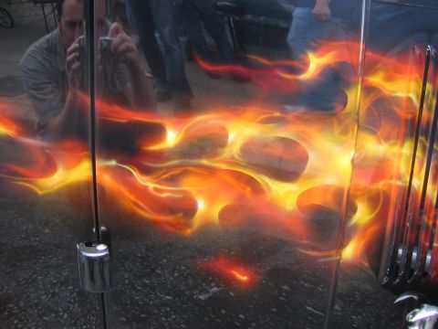 1996 Ford Bronco - Vehicle door features custom flame airbrush artwork with reflections of onlookers and a photographer.