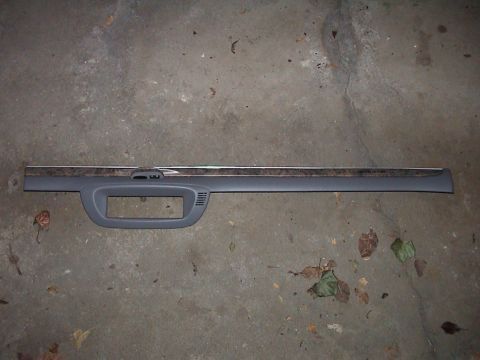 2000 Ford Crown Victoria - This dashboard trim piece features a wood grain accent and a large cutout for controls or a display.