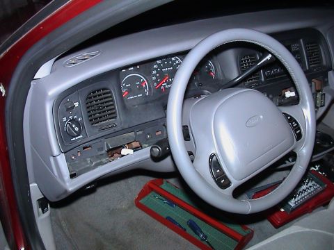 2000 Ford Crown Victoria - The interior of a 2000 Ford Crown Victoria shows the dashboard, steering wheel, and instrument cluster.