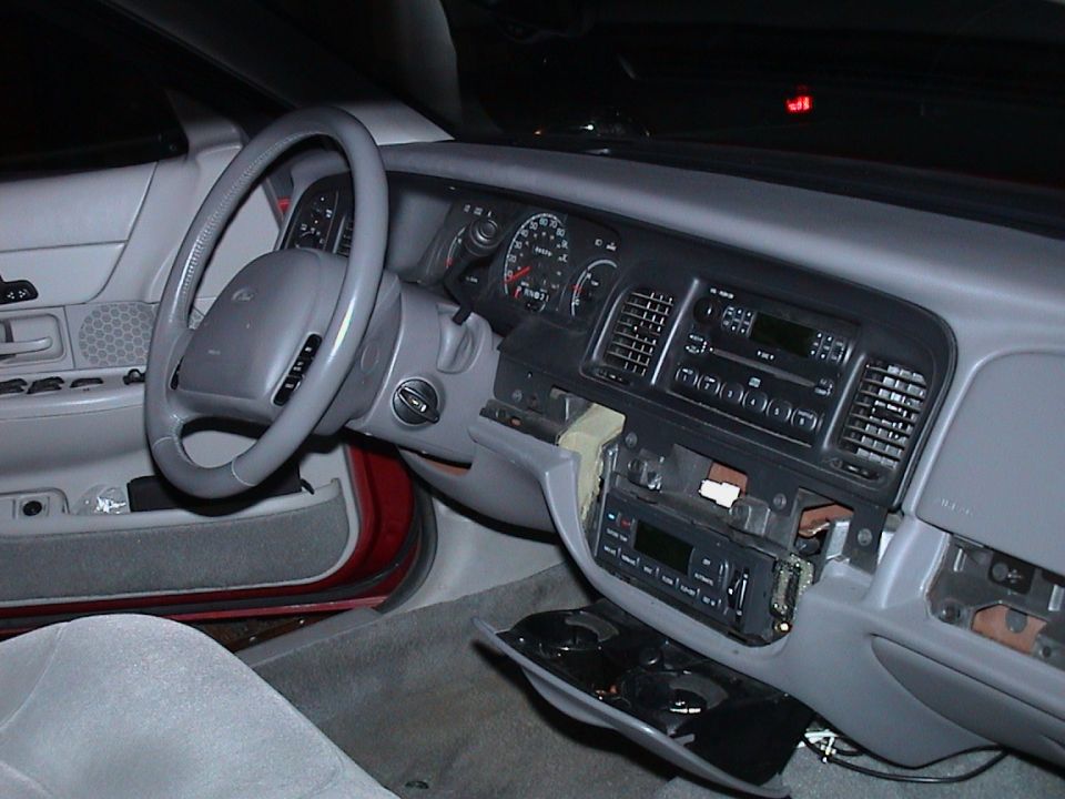 2000 Ford Crown Victoria interior dashboard with steering wheel and radio removed