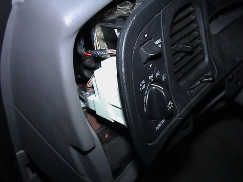 2000 Ford Crown Victoria - Close-up of the interior dashboard showing electrical components and a light control dial.