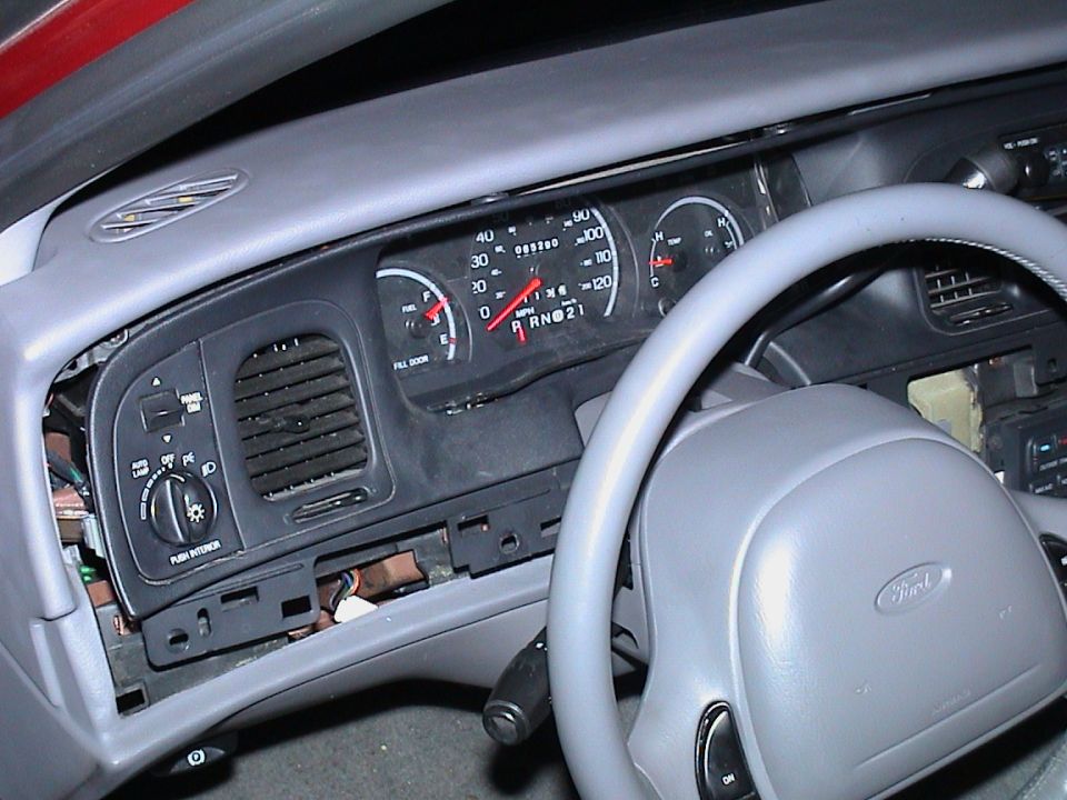 Dashboard of a 2000 Ford Crown Victoria with the center console partially removed