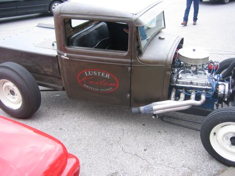 1996 Ford Bronco - Custom hot rod pickup truck with a V8 engine and custom paint logo visible on the door.