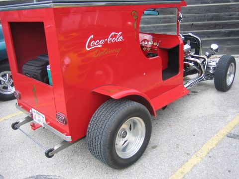 1996 Ford Bronco - Custom hot rod painted red with Coca-Cola delivery graphics and flame accents.