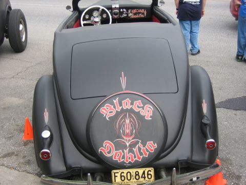 1996 Ford Bronco - This custom hot rod features a matte black finish and a spare tire cover with 'Black Dahlia' lettering.