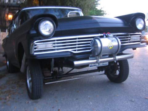 1996 Ford Bronco - Custom 1957 Ford Fairlane hot rod features a prominent external fuel tank and modified front end.