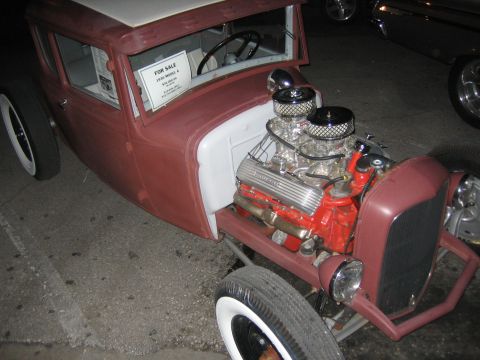 1996 Ford Bronco - A custom hot rod, possibly a 1930 Model A, is displayed with its engine and interior visible, a 'For Sale' sign.