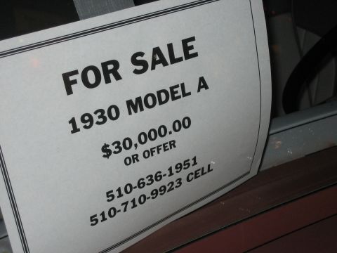 1996 Ford Bronco - Sign indicates a 1930 Model A is for sale for $30,000 or best offer.