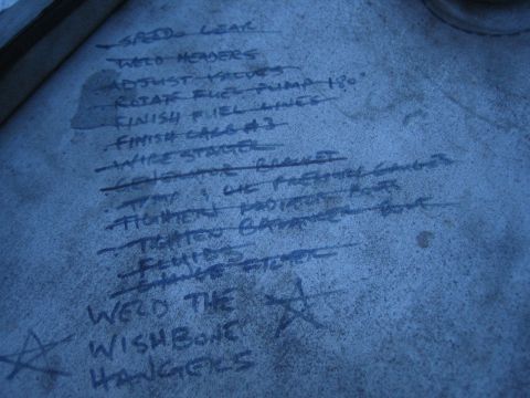1996 Ford Bronco - A handwritten list details various tasks, including mechanical work and finishing touches, on a textured surface.
