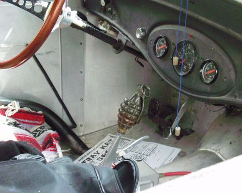 1996 Ford Bronco - Interior view of a custom vehicle a unique grenade shift knob and vintage gauges.
