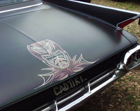 1996 Ford Bronco - Custom tiki pinstripe art adorns the trunk of a classic car.