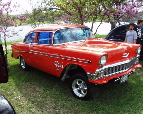 1996 Ford Bronco - This modified 1956 Chevrolet Bel Air features a prominent hood scoop and "C/Gas" lettering on the door.