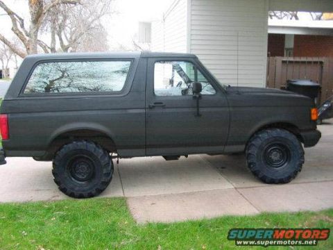1989 Ford Bronco - This 1989 Ford Bronco is presented in a matte black finish with substantial off-road tires.