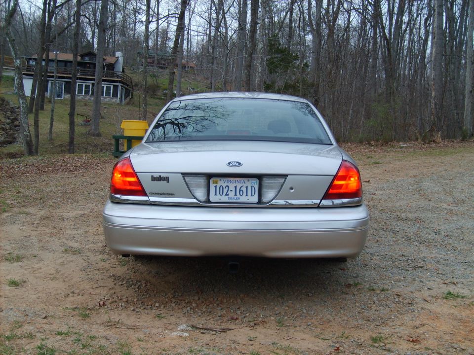 Rear view of a silver 2004 Ford Crown Victoria with Virginia license plate 102-161D