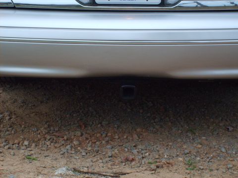2004 Ford Crown Victoria - Rear view of a 2004 Ford Crown Victoria showing the bumper and a trailer hitch receiver.