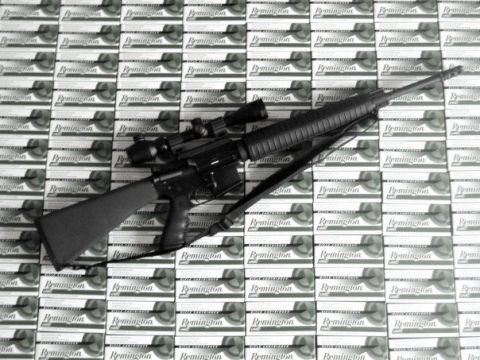 1995 Mercury Grand Marquis - Rifle with scope and Remington ammo boxes in the background.