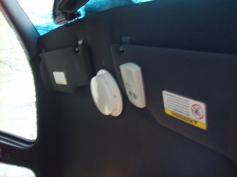 2004 Ford Crown Victoria - Interior view showing the sun visors and dome light assembly.
