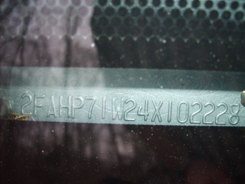2004 Ford Crown Victoria - Close-up of a vehicle's VIN plate showing the identification number.