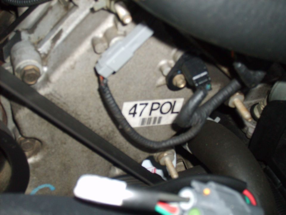 Engine block with sensor and wiring, label reads 47 POL