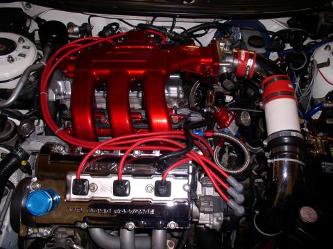 1996 Ford Probe - Engine bay details of a 1996 Ford Probe GT, highlighting its V6 DOHC 24-valve engine.