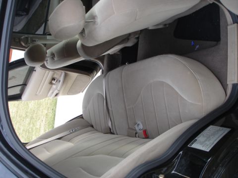 2001 Ford Crown Victoria - Interior view of a 2001 Ford Crown Victoria, highlighting the tan cloth seats and door panel.