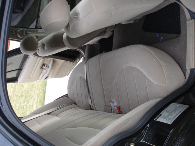 2001 Ford Crown Victoria interior showing tan cloth seats and door panel