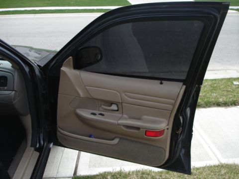 2001 Ford Crown Victoria - Interior view of a 2001 Ford Crown Victoria's driver's side door panel.