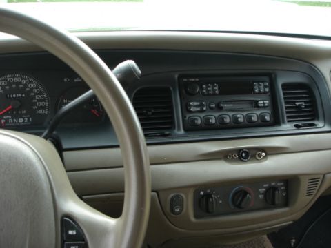 2001 Ford Crown Victoria - Interior view of a 2001 Ford Crown Victoria, highlighting the dashboard controls and driver's side instrument panel.