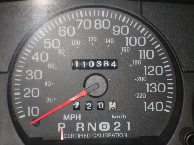 Speedometer with 110,384 miles and 'Certified Calibration' text