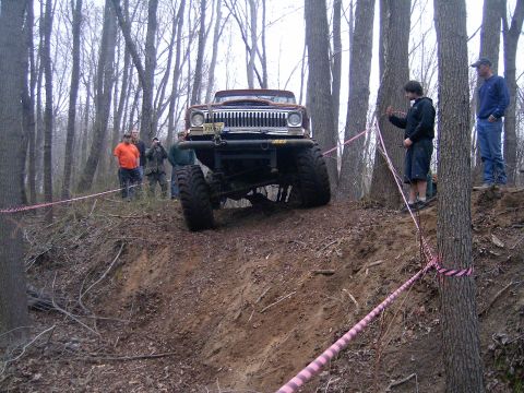 1979 Jeep J-10 - This 1979 Jeep J-10 is navigating a steep, wooded off-road course.