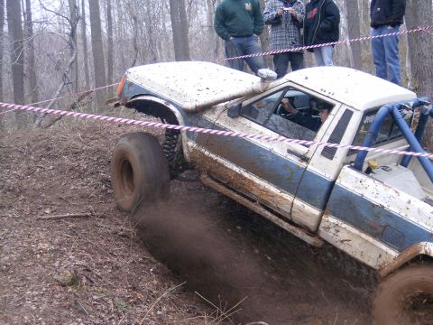 1979 Jeep J-10 - This 1979 Jeep J-10 navigates a challenging off-road course, its tires digging into the mud.