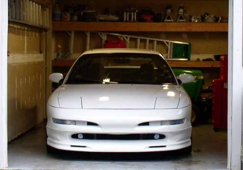 1996 Ford Probe - Front view of a white 1996 Ford Probe parked inside a garage.