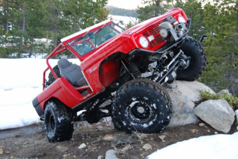 1989 Ford Bronco - This heavily modified 1989 Ford Bronco is shown navigating a rocky, snow-covered trail.