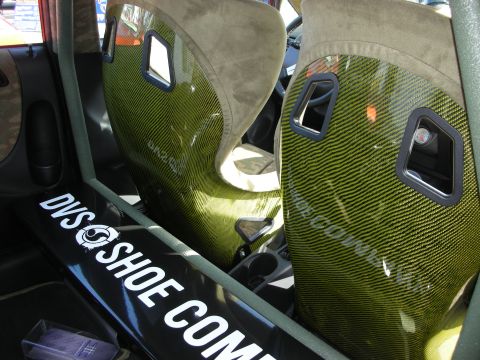 1998 Ford Crown Victoria - Custom racing seats with carbon fiber detailing and DVS Shoe Company branding are visible inside the vehicle.