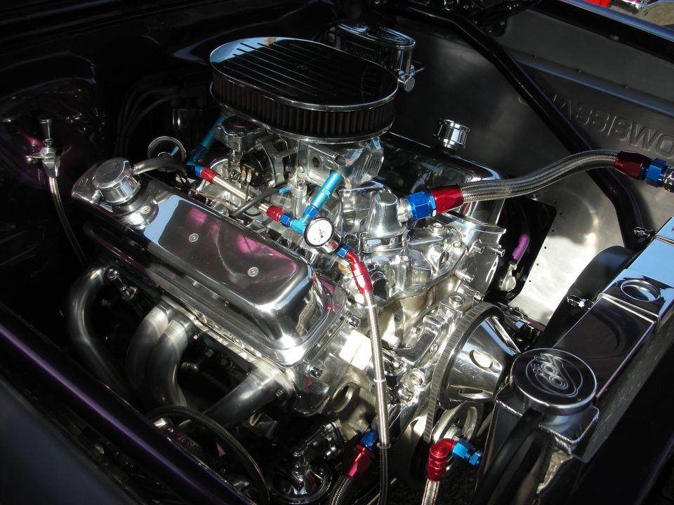 Chromed and polished V8 engine with dual carburetors and braided lines