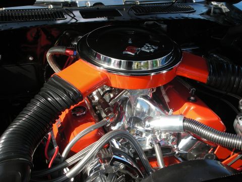 1998 Ford Crown Victoria - The engine bay features a V8 engine with chrome accents and an orange air intake system.