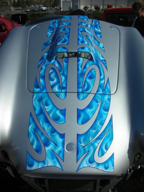 1998 Ford Crown Victoria - Car hood features custom silver paint with blue flame graphics and a prominent hood scoop.