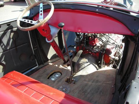 1998 Ford Crown Victoria - Interior view of a hot rod, showing the engine and driver's area.